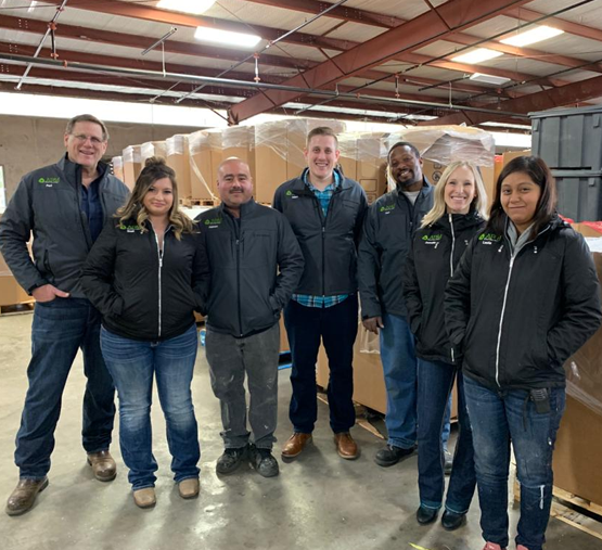 The AP&J Recycling team in the warehouse