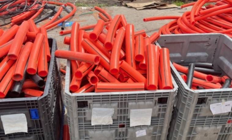 Orange plastic purgings in a gaylord box